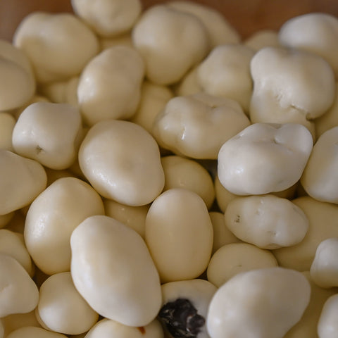 A photo of white chocolate raisins from Good Earth Peanuts