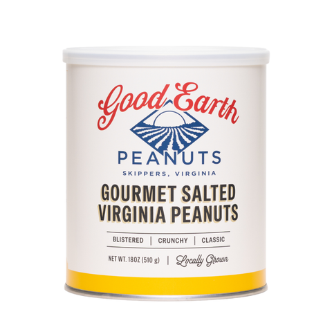 A white cylindrical canister of Good Earth Gourmet Salted Virginia Peanuts on a plain white background. The label features the brand name 'Good Earth' in red script, a blue diamond-shaped logo, and black text indicating the product is gourmet salted peanuts.